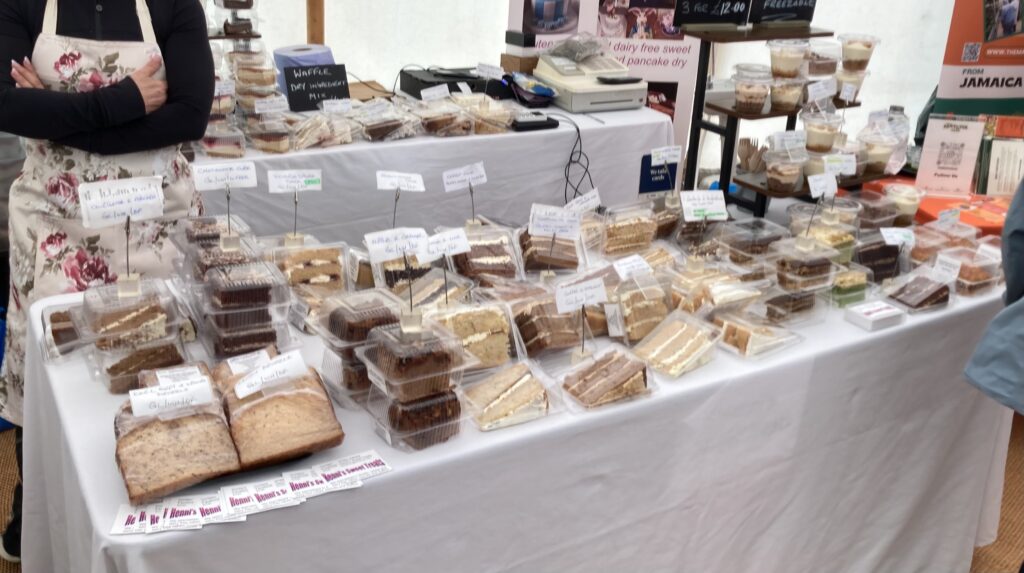 Table of gluten-free and dairy-free cake slices from Henni's Sweet Treats at the Free From Festival, Birmingham